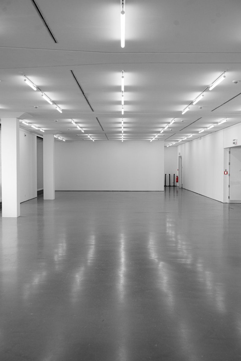 Empty modern gallery space with polished floor